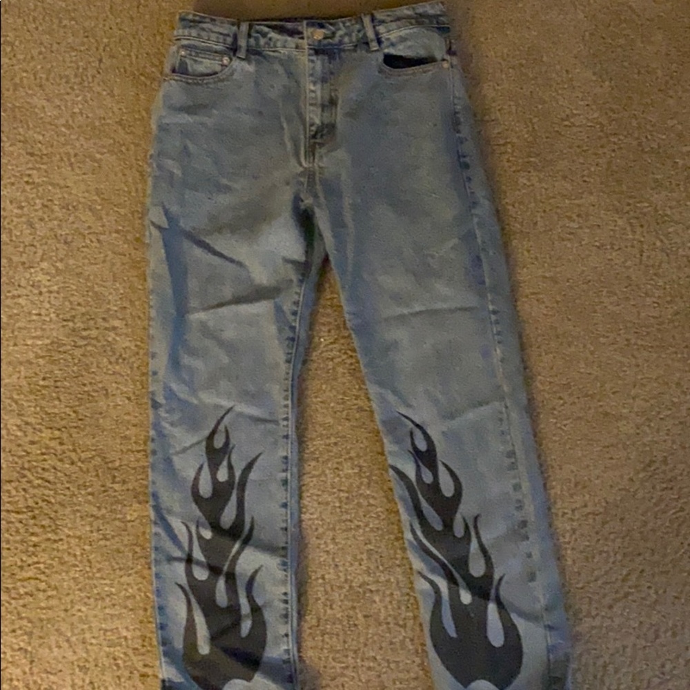 Light blue denim with black flames at bottom.